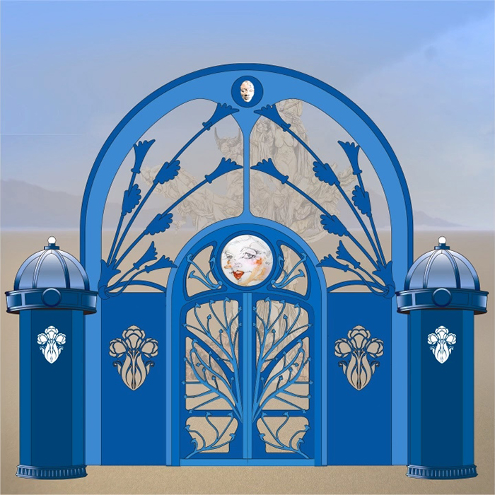 Digital rendering of the blue entrance gate on the playa, with a painted face medallion and a faint view of the tree through the arch