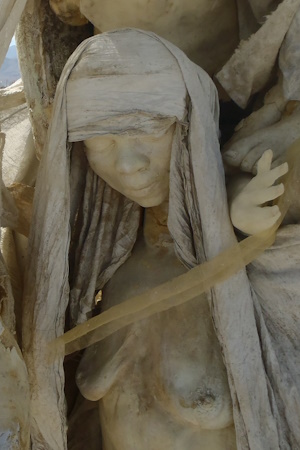 Cast figure of a calm, smiling woman