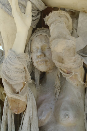 Cast figure of a woman holding another up